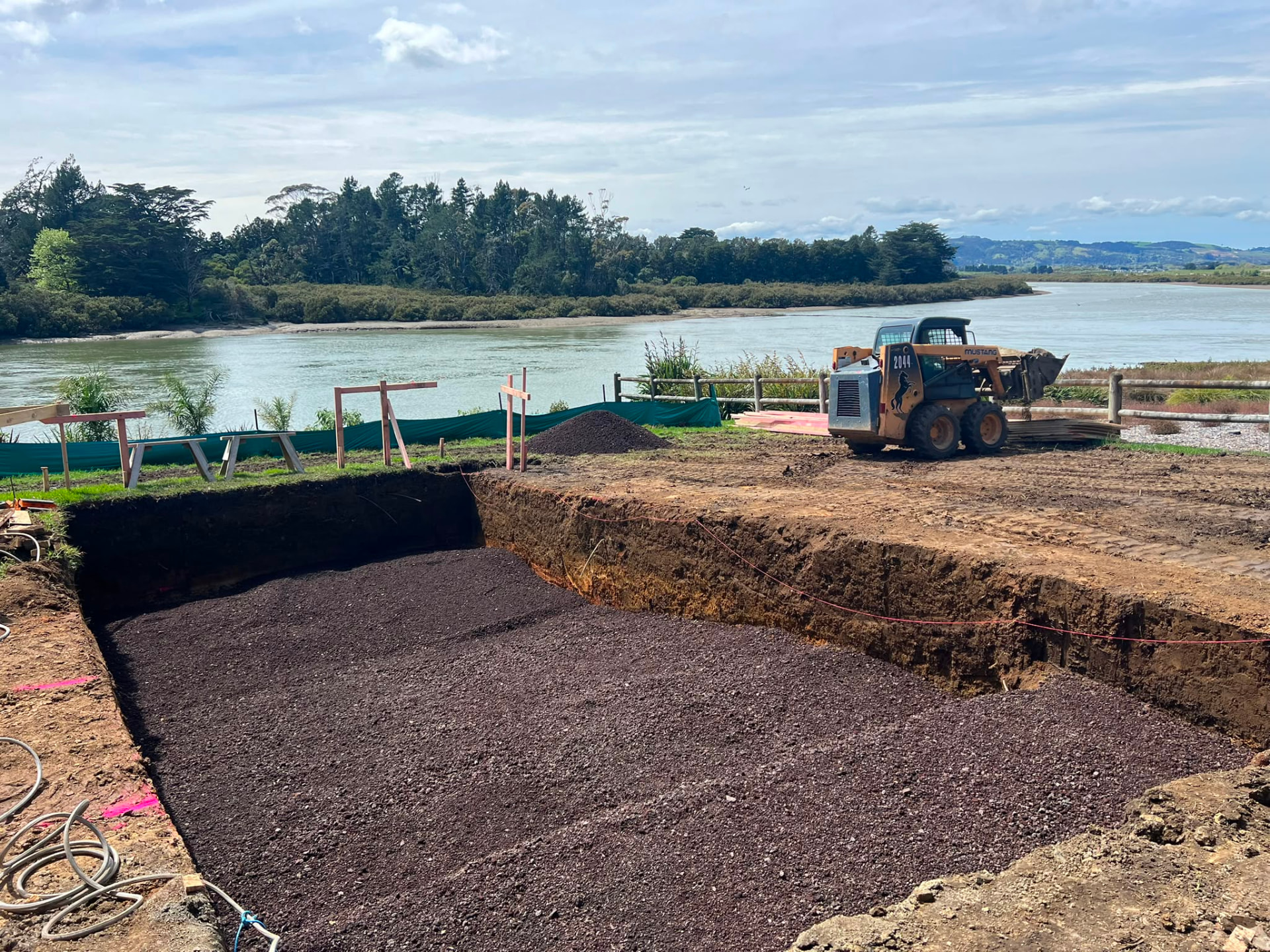 Foundation cut and hardfill on an estuary-side building site